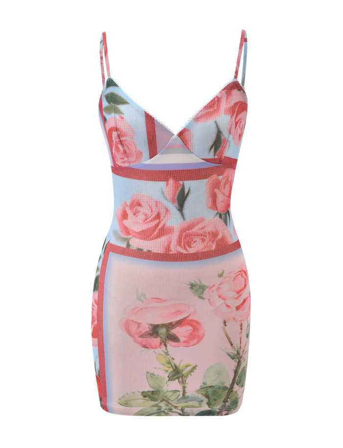 The TIGERMIST JULIANNA MINI DRESS - POSTCARD FLORAL is a sleeveless, fitted mini dress with thin straps, featuring a pink mesh floral print and rectangular color blocks in pink, green, and blue.