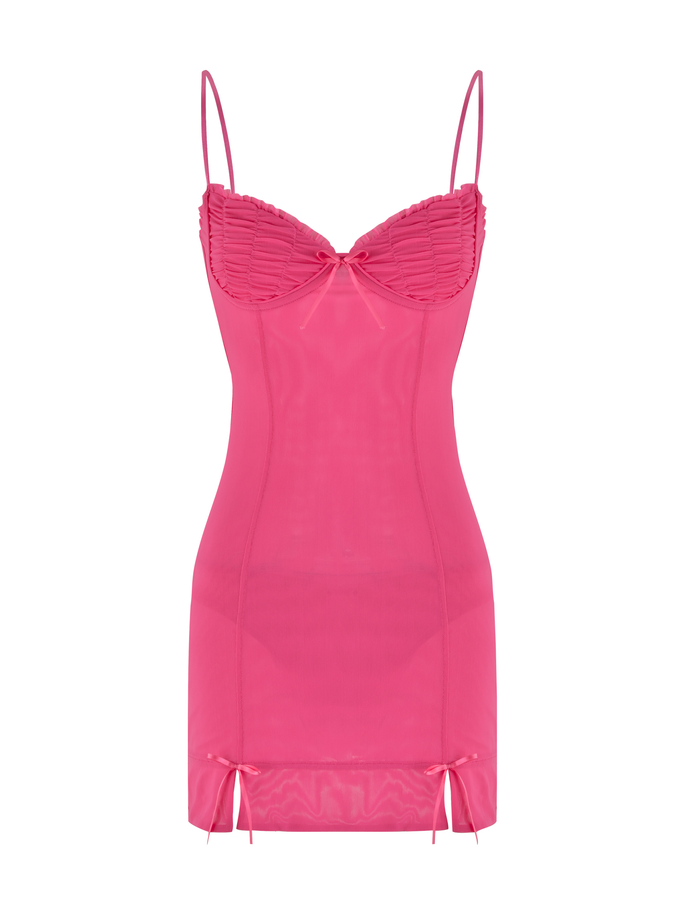 The KAIRI MINI DRESS - PINK : FUSCHIA by TIGERMIST is a fitted hot pink mesh mini dress featuring thin spaghetti straps, sheer fabric, ruched bust detailing, a center bow, and two subtle bows near the hem.