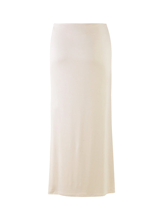 The KAROLINA JERSEY SKIRT - WHITE : OFF WHITE : IVORY from TIGERMIST is a long, high-waisted skirt with a simple, straight design. Made of soft, lightweight fabric, it falls to the ankles without any visible embellishments or patterns.