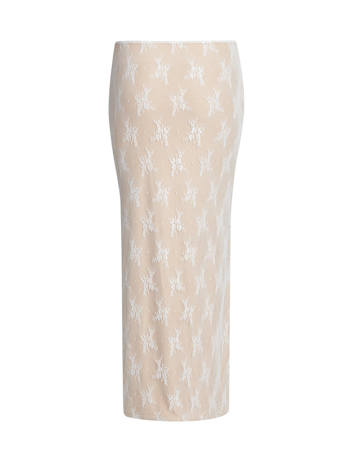 Introducing the KAROLINA SKIRT by TIGERMIST: a white lace pencil skirt with a straight silhouette, adorned with an intricate floral pattern throughout. The lightweight fabric extends below the knee and showcases a clean, minimalist design without any visible seams, zippers, or pockets.