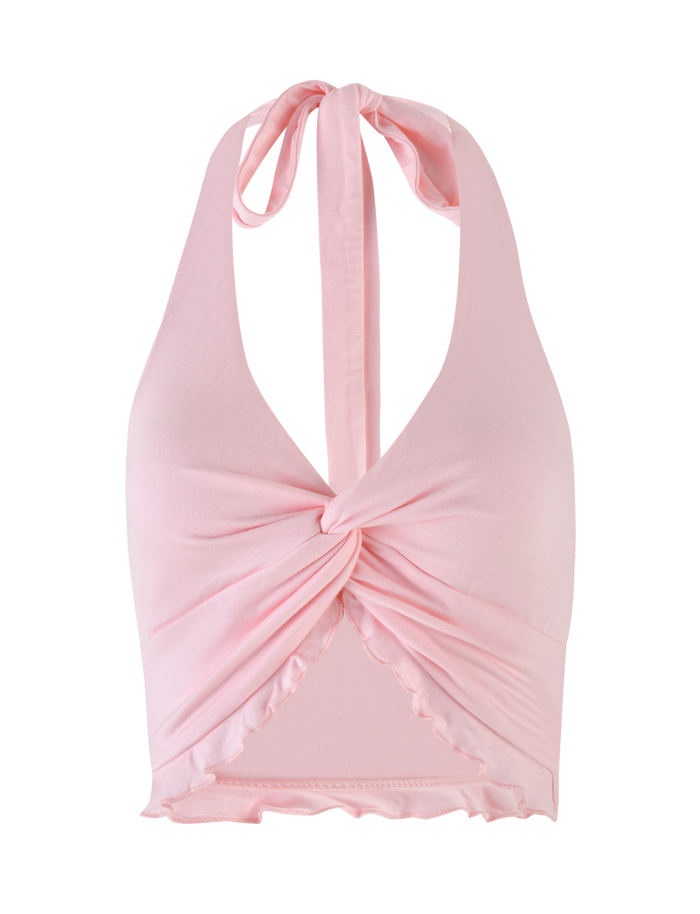 The TIGERMIST KATYA HALTER TOP in pale pink features a front twist knot, ruched fabric, neck tie closure, and a cropped hem with ruffled edges for a soft, feminine touch.