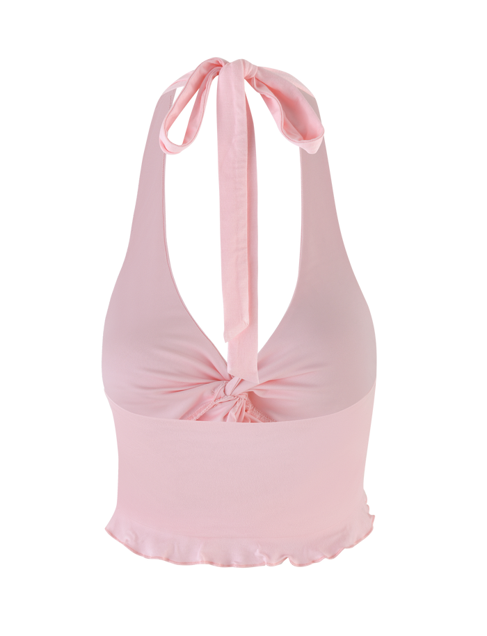 The KATYA HALTER TOP by TIGERMIST features a pale pink hue, deep V-neckline, center twist, wide self-tie bow at the neck, and a slightly ruffled hem for a soft, feminine touch.