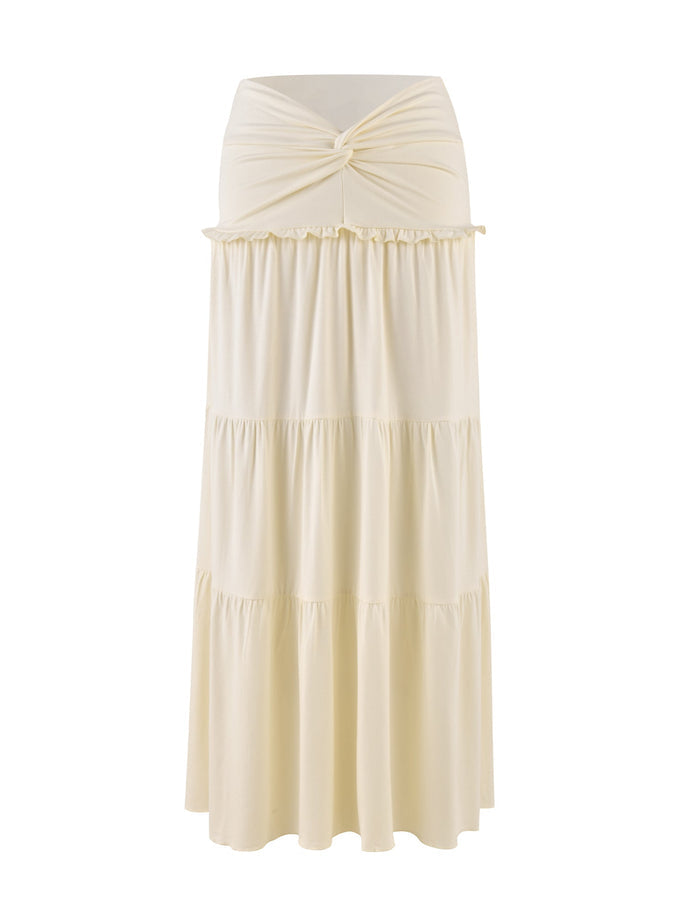 The TIGERMIST KATYA MAXI SKIRT in cream features a waistband twist and tiered fabric for an elegant, flowing look.