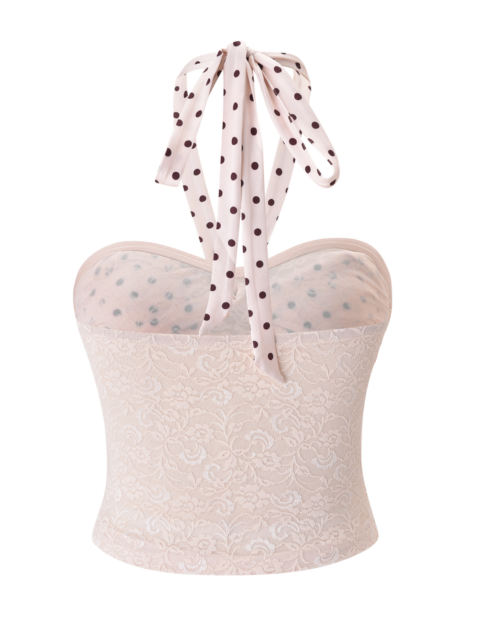 The KAYLI TOP - CREAM by TIGERMIST is a light pink lace strapless top with a sheer polka dot mesh overlay and matching halter tie, shown on a plain white background.