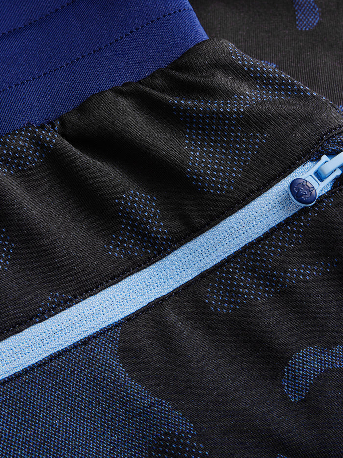 Kennebec Camo Short back zip pocket close-up with wolf logo zipper pull, Maltese Blue camo - men's golf shorts | Greyson Clothiers