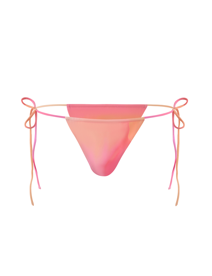 The KHESSA BIKINI BOTTOM - PINK HIBISCUS by TIGERMIST features a pink and peach gradient with adjustable side ties on each side, shown against a white background.