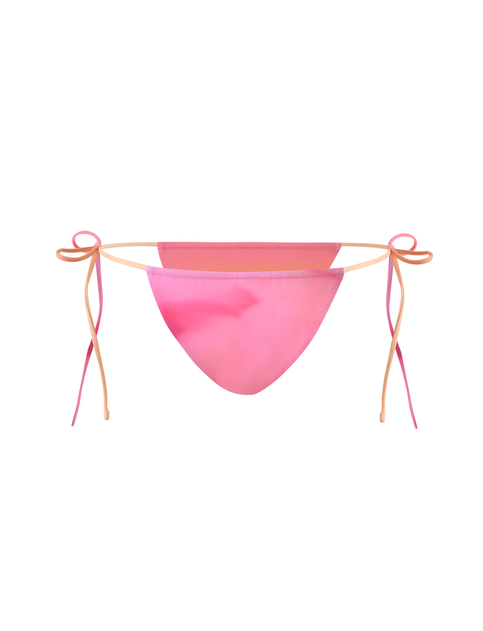 The TIGERMIST KHESSA BIKINI BOTTOM in Pink Hibiscus features adjustable side ties and a body-con silhouette, shown against a white background.