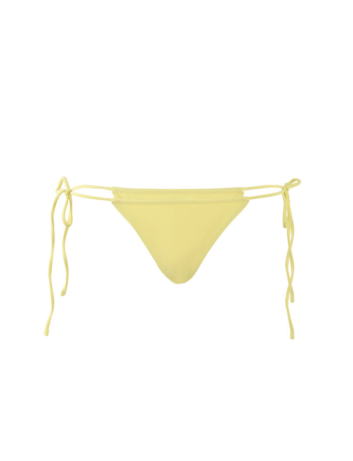 A yellow KHESSA BIKINI BOTTOM - LEMON from TIGERMIST with side ties sits against a plain white background. The bikini bottom features a classic triangular cut and adjustable strings on each side for a perfect fit.