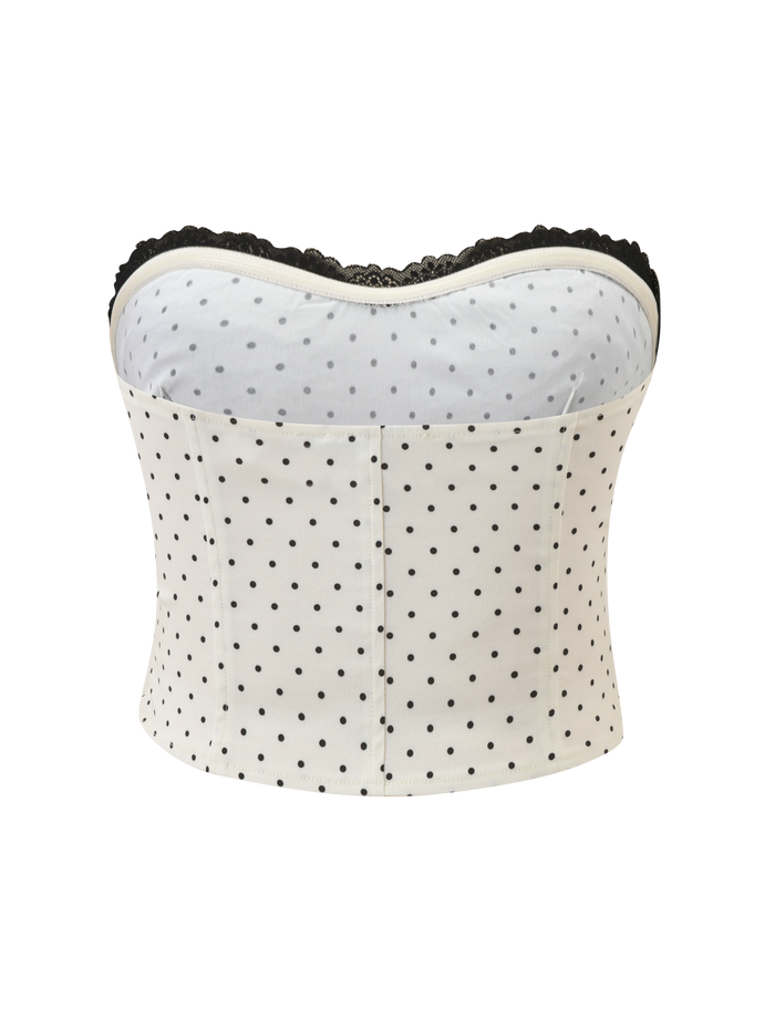 The TIGERMIST KITTIE LACE CORSET - CREAM DOT features a strapless cream design with playful polka dots and elegant black lace trim, shown against a white background.