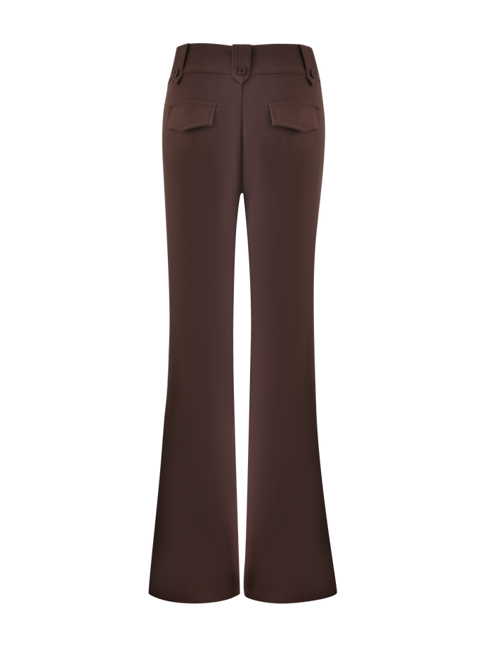 The KITTIE PANT - BROWN : CHOCOLATE by TIGERMIST is shown from the back, featuring two flap pockets, a back hem slit, and a subtle flare for added style.