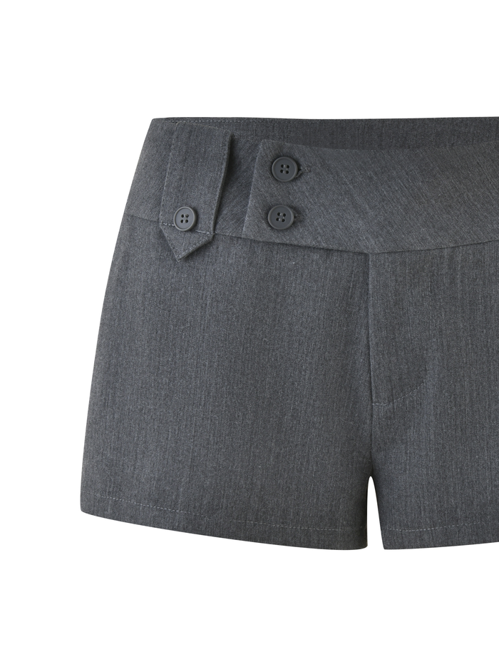 The KITTIE SHORT - GREY by TIGERMIST is a high-waisted, bodycon short featuring three decorative black buttons on the left waistband and made from structured suiting fabric for a polished look.