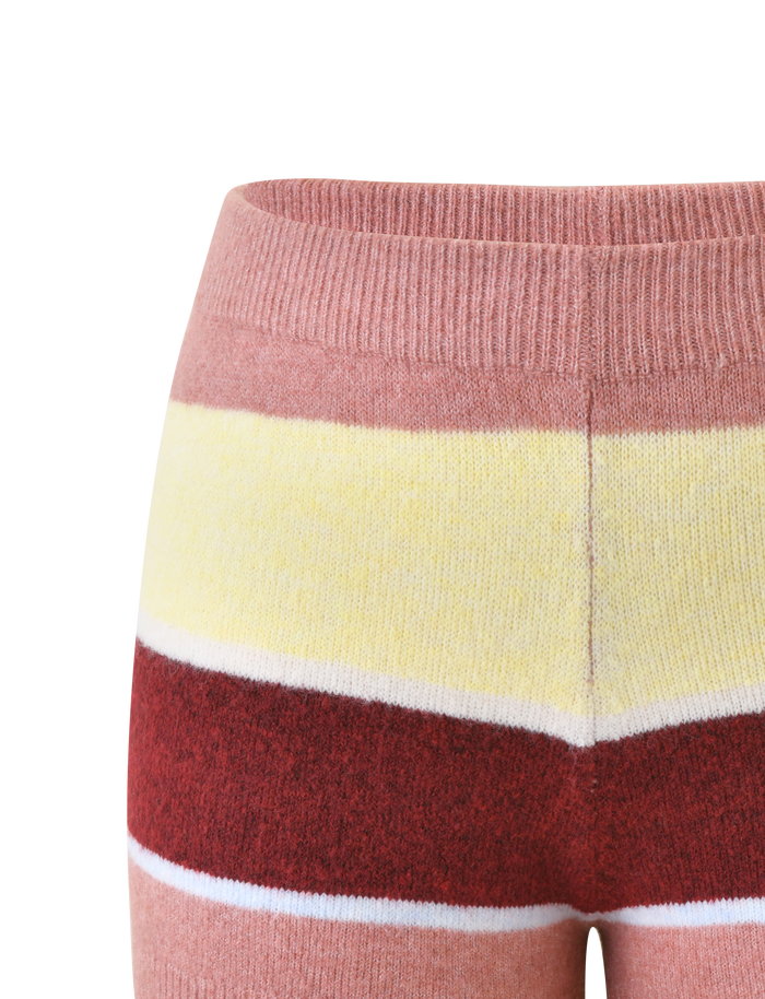 Close-up of the KOA 2.0 STRIPED SHORT - TAN STRIPE by TIGERMIST, a knit mini short with pink, yellow, burgundy, and white multicolour stripes, shown from waist to mid-thigh against a plain white background.