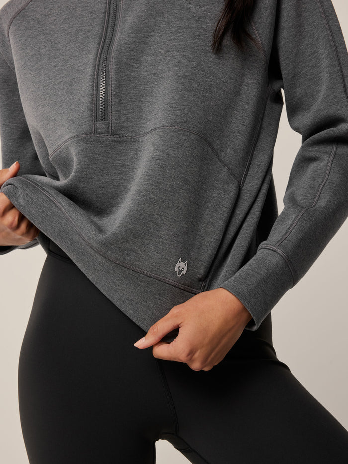 Smoke Heather Kristina Half-Zip Sweatshirt - Wolf Logo & Cropped Hem Close-Up, Melange Fabric | Greyson Clothiers