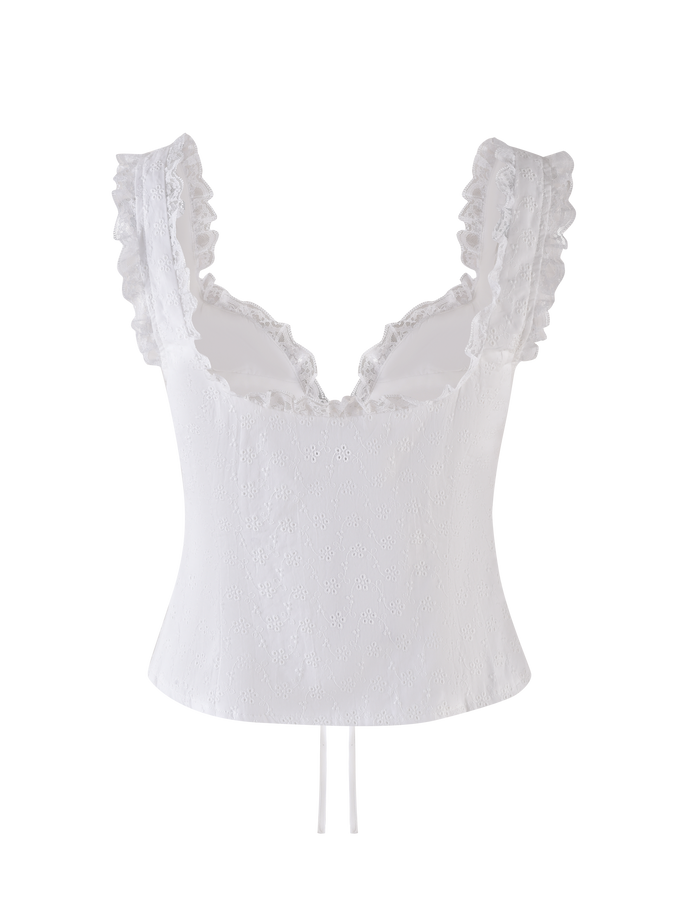 The KYANA TOP - WHITE by TIGERMIST is a sleeveless broderie crop camisole featuring a fitted silhouette, sweetheart bust, ruffled lace-trimmed straps, and a subtle textured pattern, shown against a plain background.