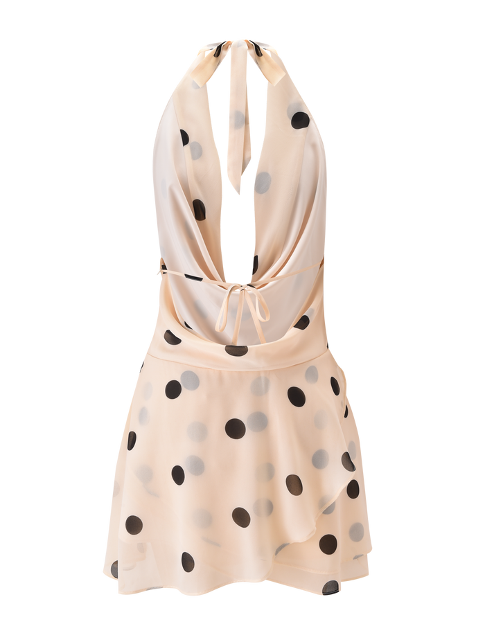 The LATHAN MINI DRESS by TIGERMIST is a sleeveless, cream chiffon halter mini dress with polka dots, a deep plunging neckline, tie at the neck, and a flowing, slightly flared skirt for a playful yet elegant style.