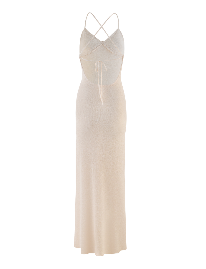 The TIGERMIST LAVELLE MAXI DRESS in cream features a crisscross halter neckline with adjustable straps, an open back with tie detail, a fitted silhouette, and a long flowing skirt.