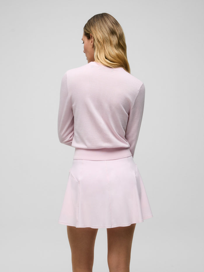 Bloom Leith Cardigan Sweater - Back View, ribbed hem, relaxed wool-silk fit styled with pink skort | Greyson Clothiers