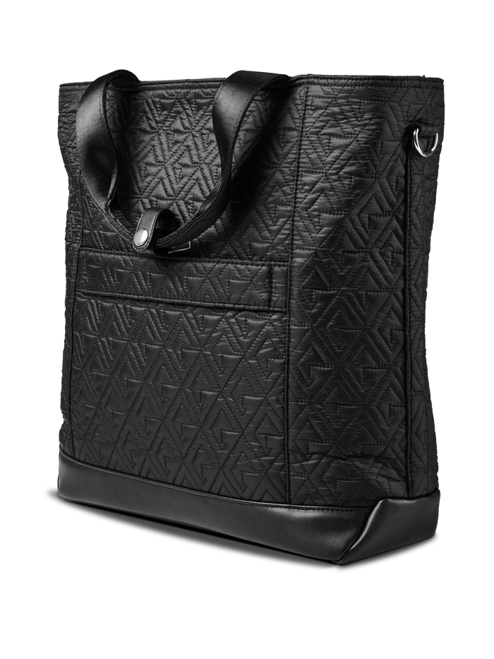 Greyson Clothiers Leland Tote black quilted fabric with leather base and D-ring - Side Angle View | Greyson Clothiers