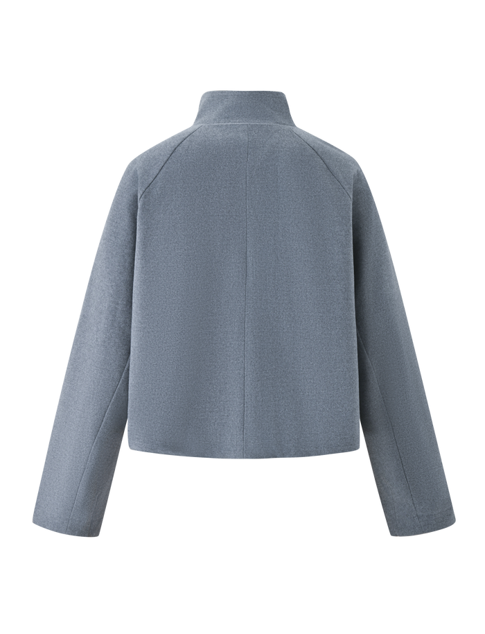 The LENNEX JACKET by TIGERMIST in heather charcoal is shown from the back, featuring a minimalist oversized design with a mock neck collar, straight hem, and deep hidden-zip pockets for a sleek look without visible embellishments.