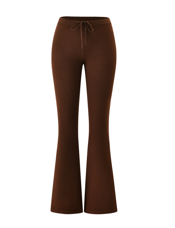 The LEORA PANT - CHOCOLATE by TIGERMIST features a high-waisted, flared silhouette and adjustable drawstring waist, shown against a white background.