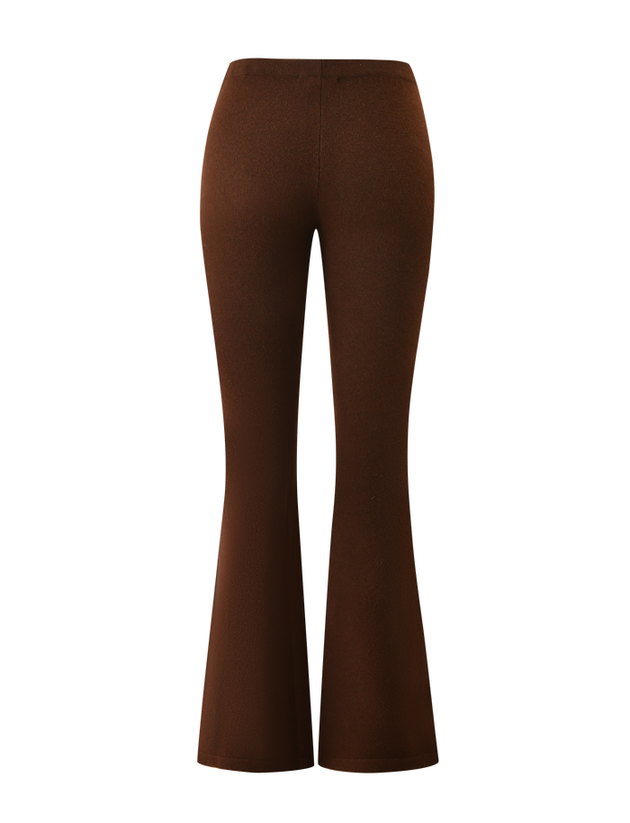 Back view of the TIGERMIST LEORA PANT - CHOCOLATE: chocolate brown knit flared pants with a smooth, fitted waist and hips, elegantly widening from knee to hem.