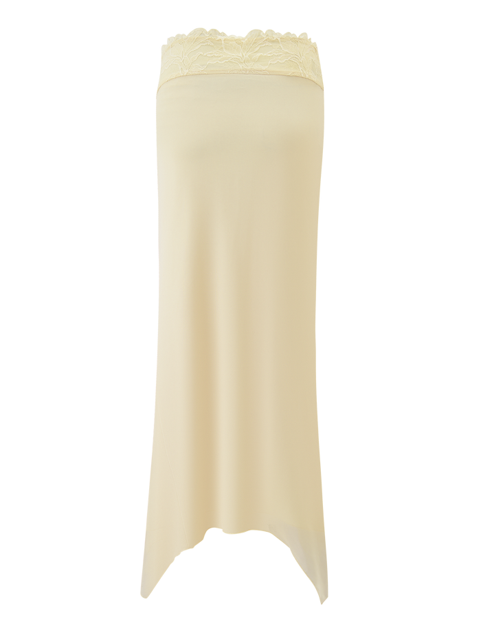 The LILLIAN SKIRT - YELLOW by TIGERMIST features a light yellow hue, lace trim waistband, and asymmetrical hem, shown on a plain background.