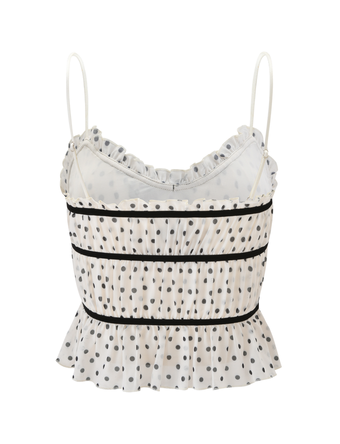The LIORA TOP - POLKA DOT by TIGERMIST features white polka dots, thin spaghetti straps, ruffled trim on the neckline and hem, horizontal black piping, and a chic sleeveless design.
