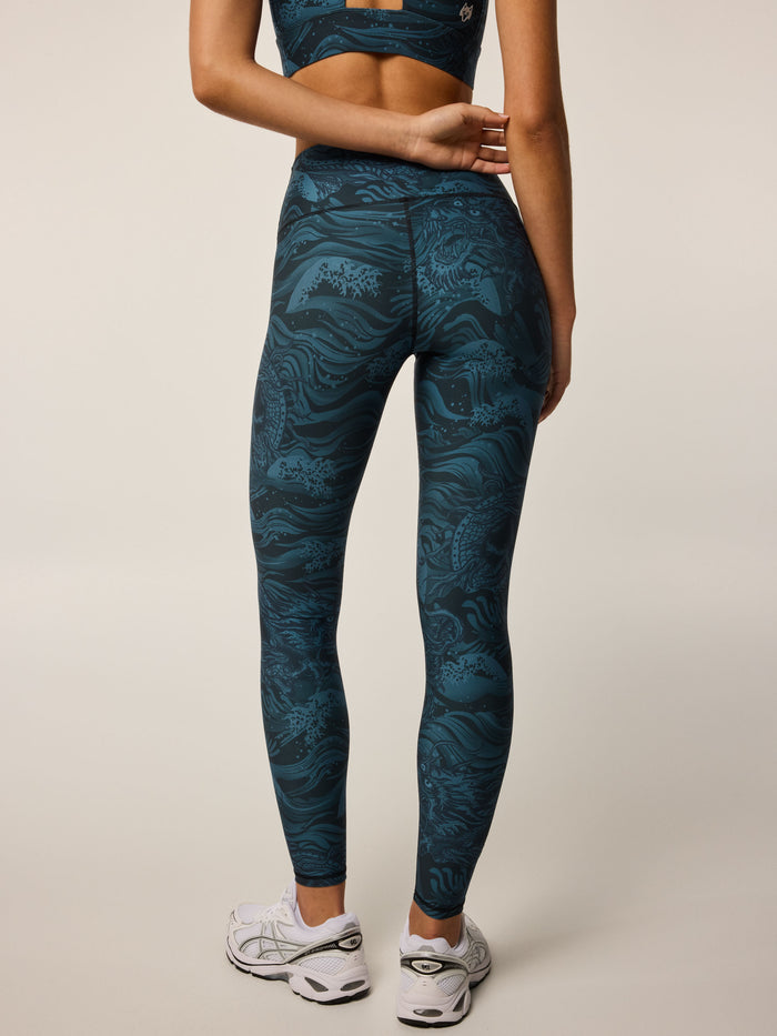Aegean Luna Magic Dragon Legging, Greyson wolf detail, dragon-print Italian fabric, high-waist, back view - On Model | Greyson Clothiers