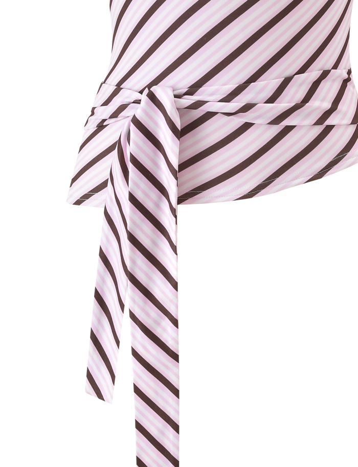 The LYLE ONE SHOULDER TOP - PINK STRIPE by Tiger Mist USA features a diagonal stripe print in white, pink, and dark brown. A waist knot creates a draped effect. Shown against a plain white background.