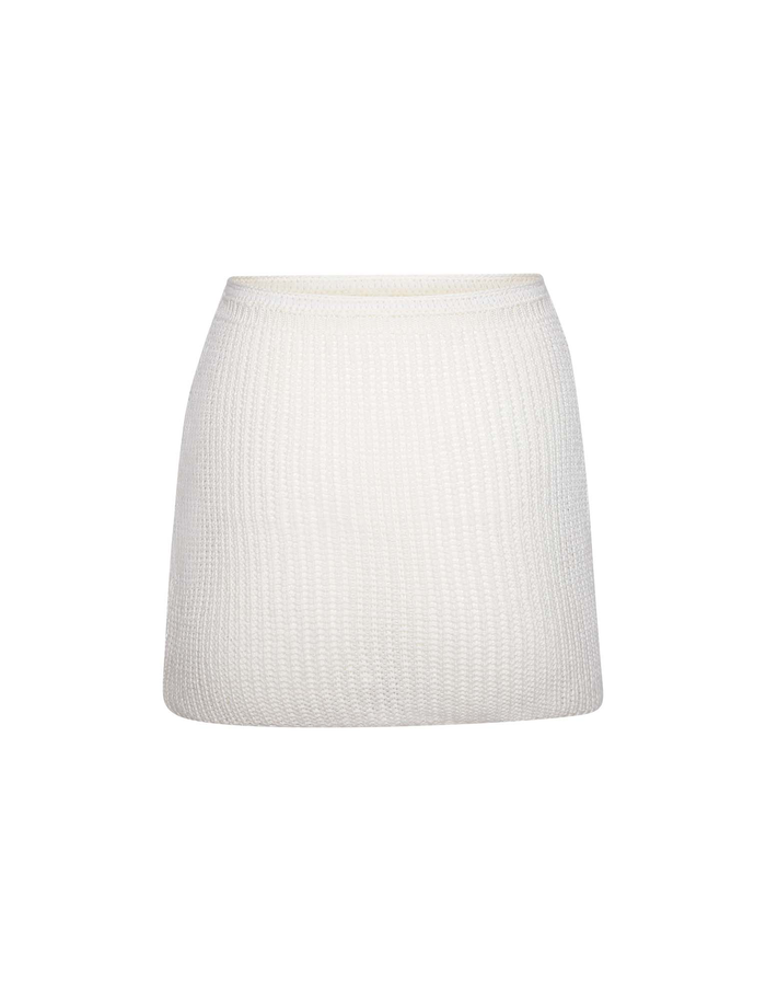 The MACAULEY MINI SKIRT by TIGERMIST is a white, ribbed-knit mini skirt with a textured, bodycon fit, shown against a plain white background.