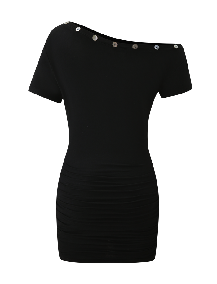 The MARITA DRESS - BLACK by TIGERMIST is a short black mini dress in buttery jersey with an asymmetrical neckline, short sleeves, metallic shoulder buttons, and subtle ruching on the lower half.