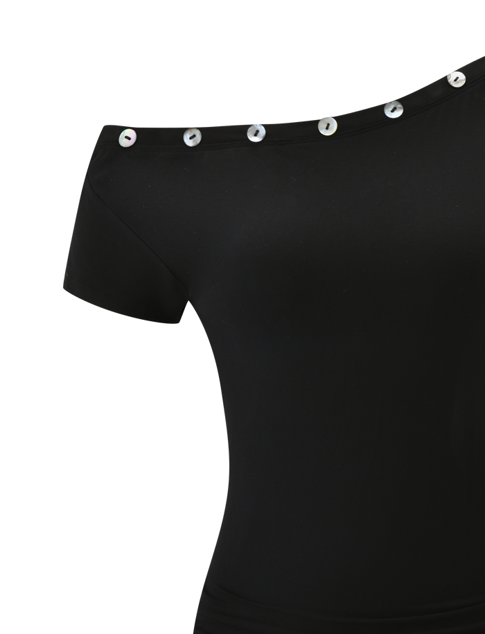 The MARITA DRESS - BLACK by TIGERMIST features short sleeves, an asymmetrical neckline, and large, shiny round buttons on the top edge, all crafted from buttery jersey for a sleek finish.