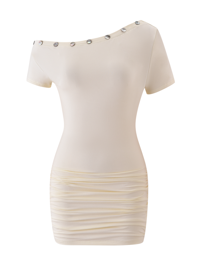 The MARITA MINI DRESS - CREAM by TIGERMIST features an asymmetrical neckline, short sleeves, silver shoulder buttons, and ruched skirt detailing in buttery jersey for a sleek bodycon fit.