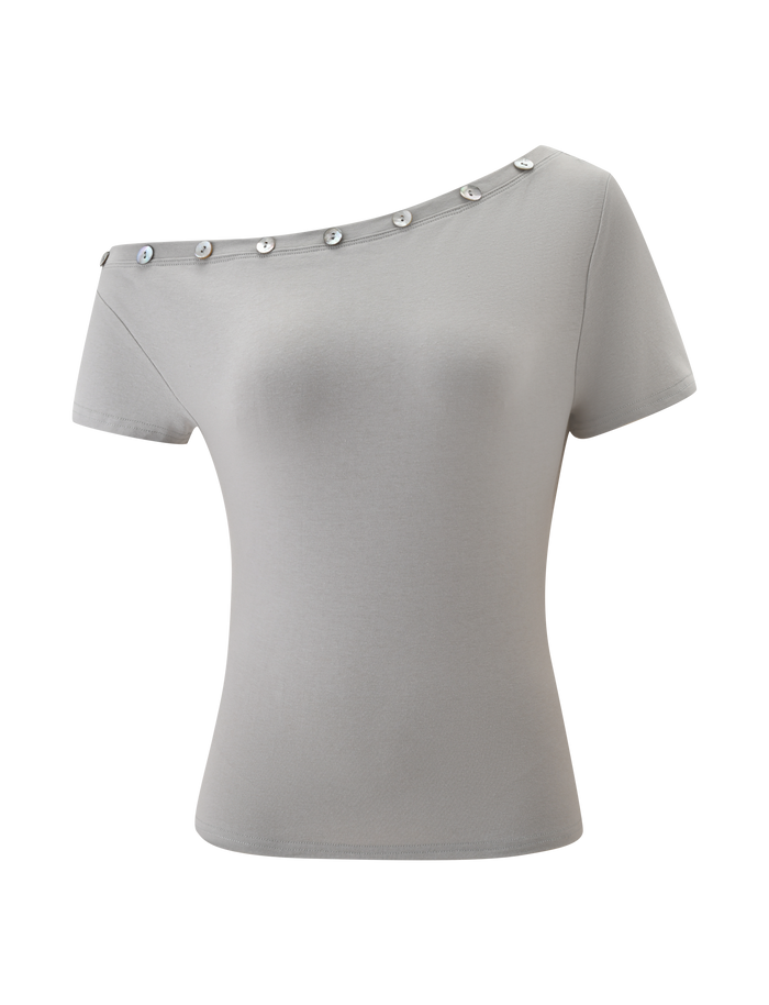 The MARITA TOP by TIGERMIST is a dove grey, fitted women's off-shoulder tee with short sleeves, an asymmetrical neckline, and decorative silver buttons for a modern minimalist touch—perfect for any occasion.