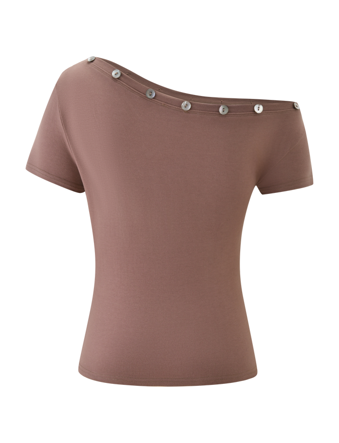 The MARITA TOP - MOCHA by TIGERMIST features a mocha, short-sleeve, off-the-shoulder design with an asymmetrical neckline and bold silver button details; displayed on a plain white background.