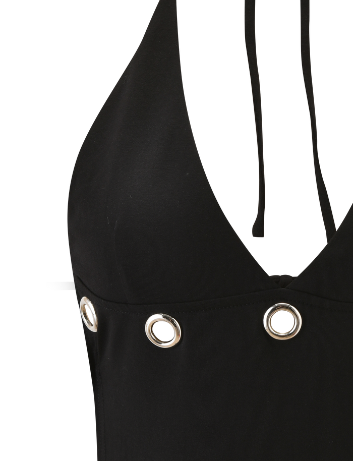 Close-up of the TIGERMIST MARREN TOP - BLACK, featuring a halter neck with silver grommet details and thin neck ties, shown against a white background.