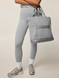Greyson Clothiers Melange Kristina Tote in Light Grey Heather - On Model Side View, Carried by Hand