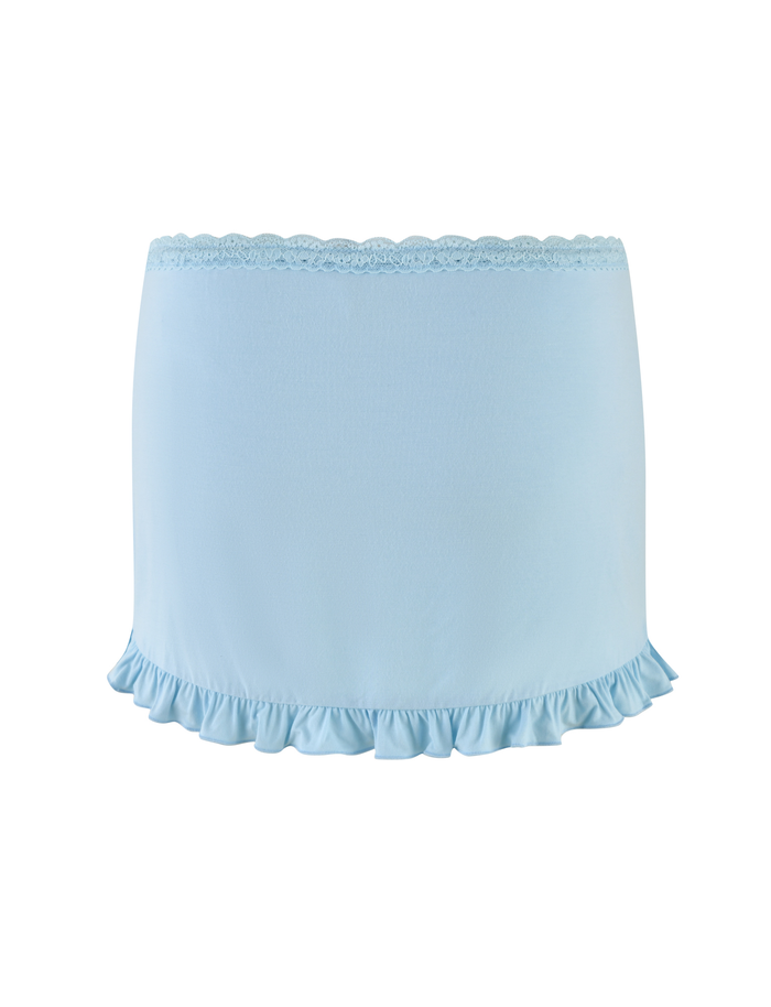 The TIGERMIST MELLIE SKORT - BLUE in baby blue features tonal lace trim and a ruffled hem, shown against a white background.