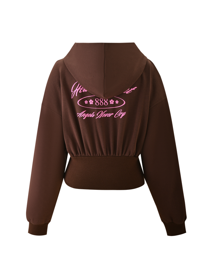 The MERRYN HOODIE - CHOCOLATE by TIGERMIST is a brown cropped hoodie with long sleeves, a hood, and custom pink puff print script on the back reading "888" and "Angels Wear Cry," plus stylized decorative accents.
