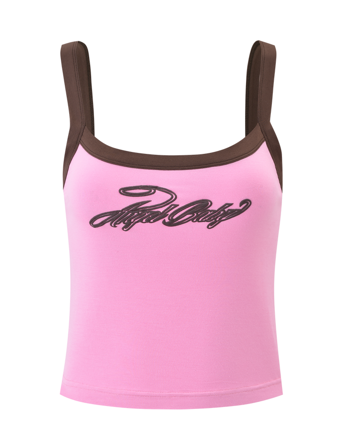 The MERRYN TANK - PINK by TIGERMIST is a pink graphic tank with wide brown straps and "Angel Baby" in black cursive across the chest.