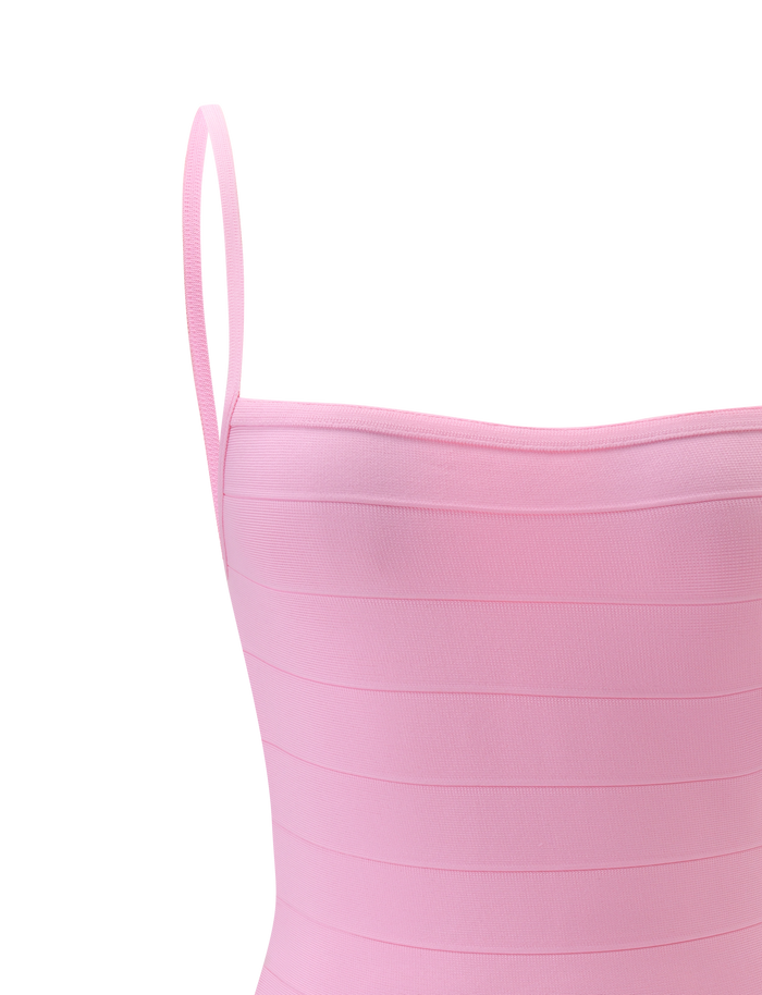Close-up of the TIGERMIST MIDORI BANDAGE MINI DRESS in baby pink, featuring a sleeveless design, thin shoulder straps, and a horizontal ribbed texture against a plain white background.