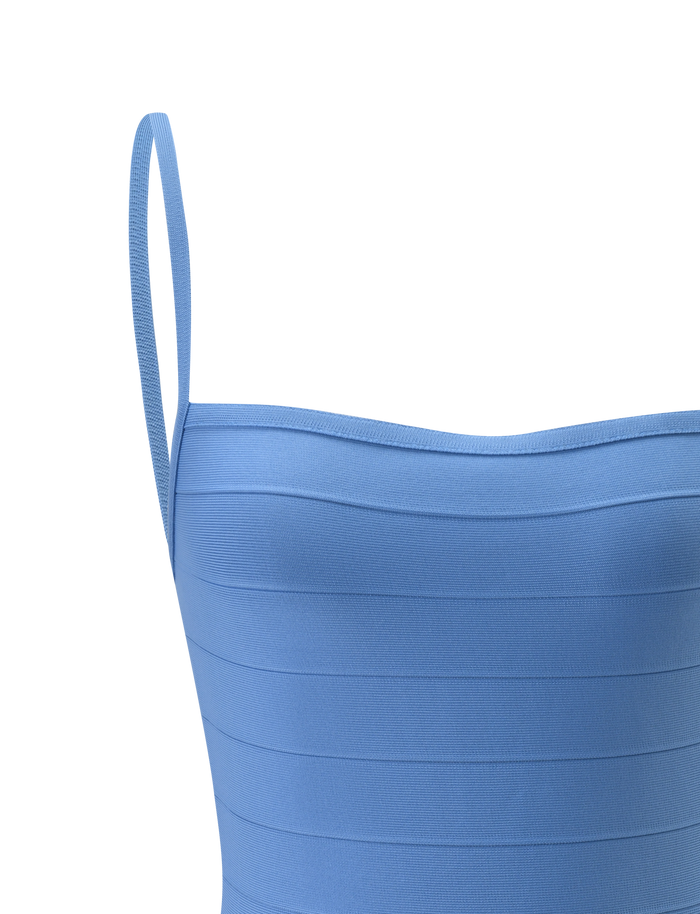 Close-up of the MIDORI BANDAGE MINI DRESS by TIGERMIST in blue, featuring thin shoulder straps and a horizontal ribbed texture, shown against a plain white background.