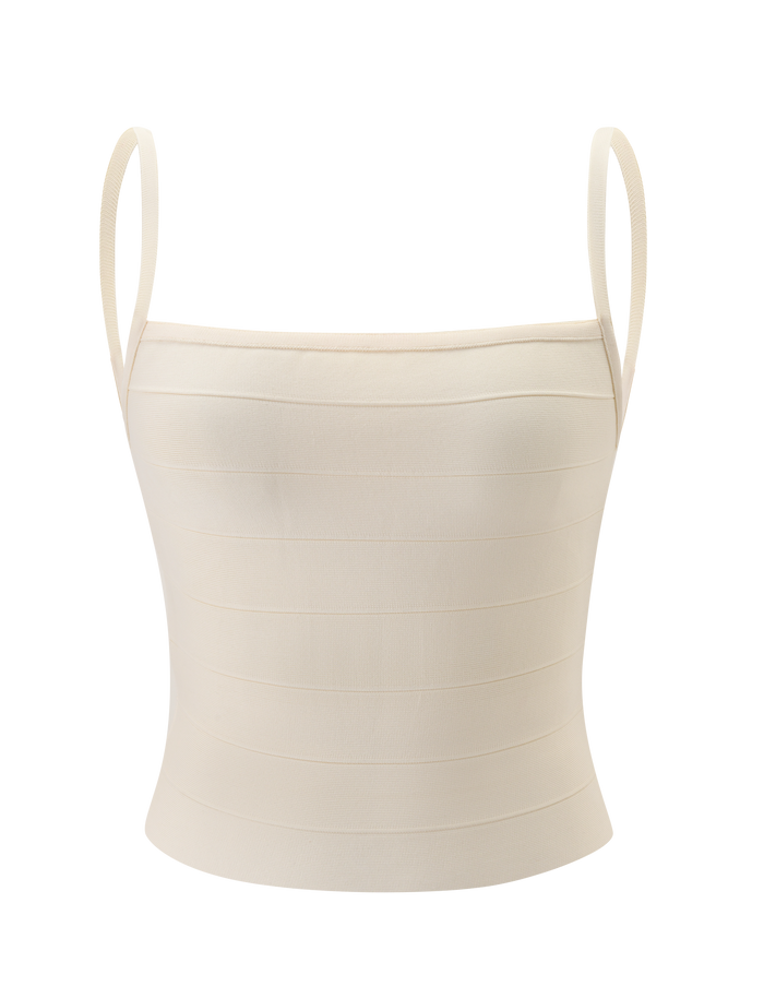 The TIGERMIST MIDORI BANDAGE TOP in cream features a fitted, minimalist design with thin shoulder straps and subtle horizontal seams for a sculpted waist look, showcased against a plain white background.