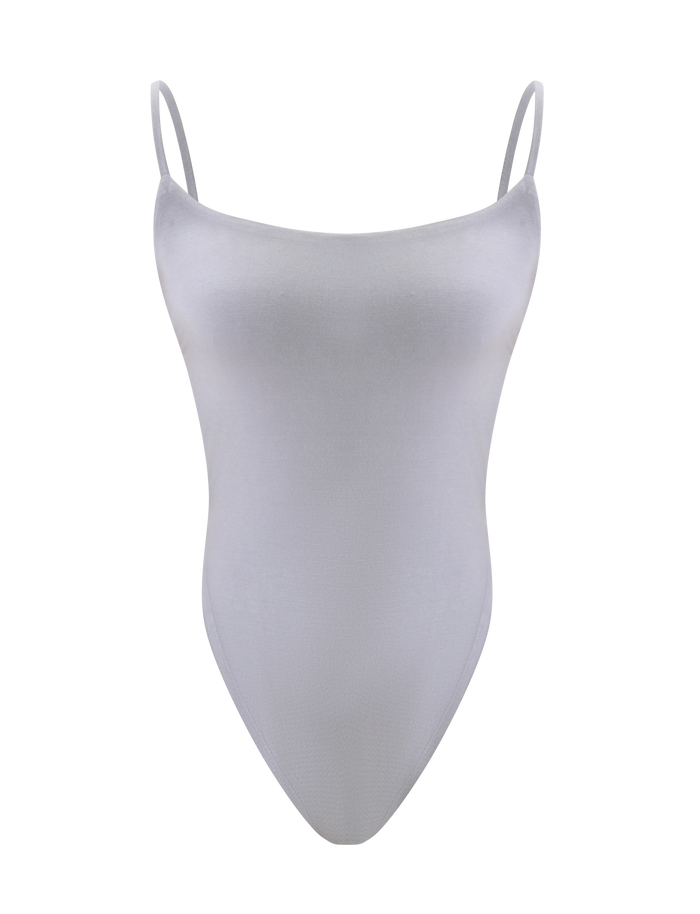The MINERVA BODYSUIT - FROST GREY by TIGERMIST is a fitted, plain light gray bodycon piece with thin spaghetti straps, a backless design, and high-cut legs, shown on a white background.