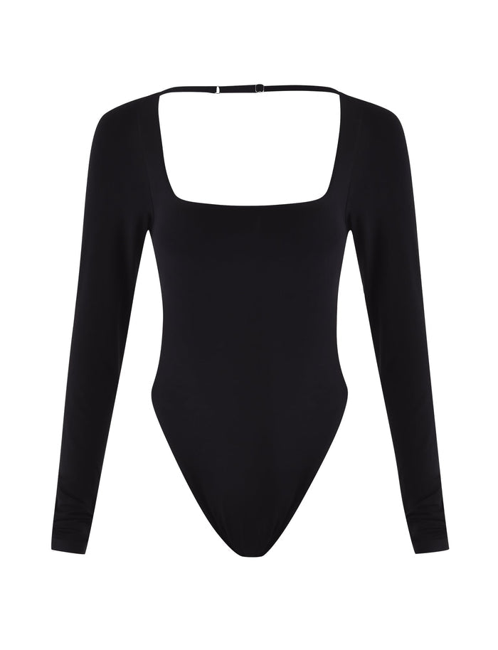 The MINERVA LONG SLEEVE BODYSUIT - BLACK by TIGERMIST features a sleek bodycon fit, long sleeves, square neckline, and high-cut legs, shown against a white background.