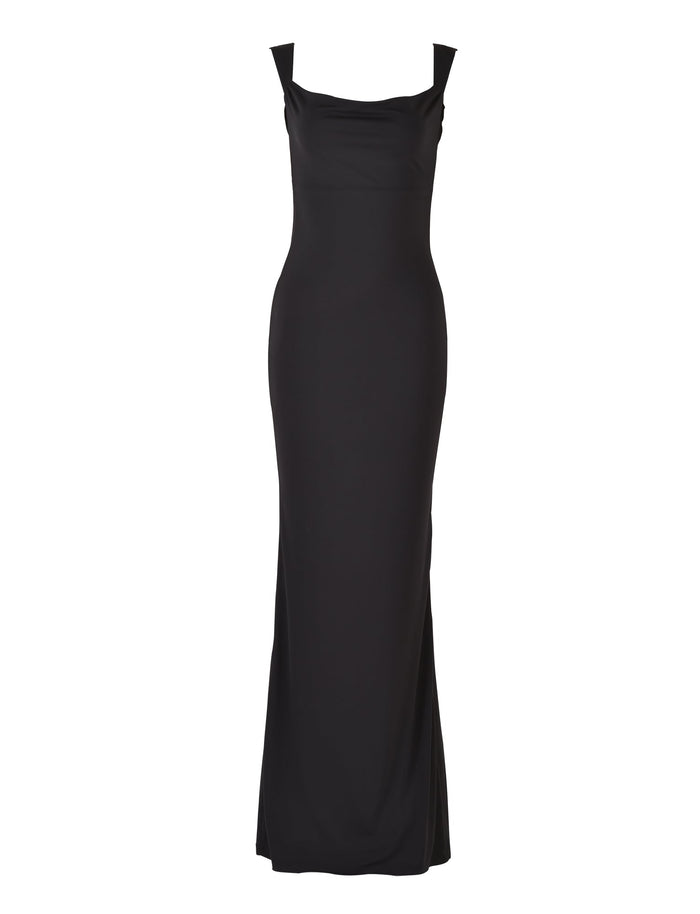 The MORANA DRESS - BLACK by TIGERMIST is showcased against a plain white background, featuring wide straps and a slightly draped neckline. This sleek, full-length dress offers a form-fitting design and a smooth, elegant silhouette.