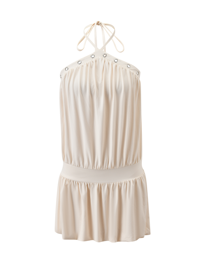 The TIGERMIST NATASHA DRESS - CREAM is a sleeveless mini dress featuring a halter neckline, gathered detail, silver grommet accents, elastic waistband, and slightly flared skirt. Its soft, flowing fabric enhances the simple yet elegant design.