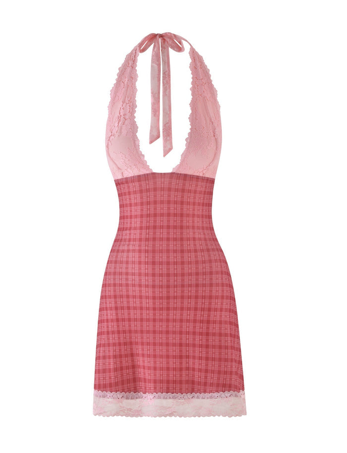 The NAVIA DRESS - RED by TIGERMIST blends feminine charm and bold design in a red check pattern. It features a deep neckline, pink lace-trimmed hem, and an A-line silhouette, with elegant halter ties behind the neck.