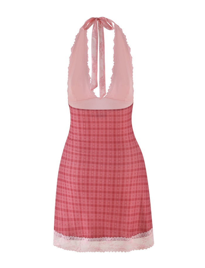 The NAVIA DRESS - RED by TIGERMIST is a red check halter mini dress with a plaid pattern, pink lace trim, deep V-neck, and open back.