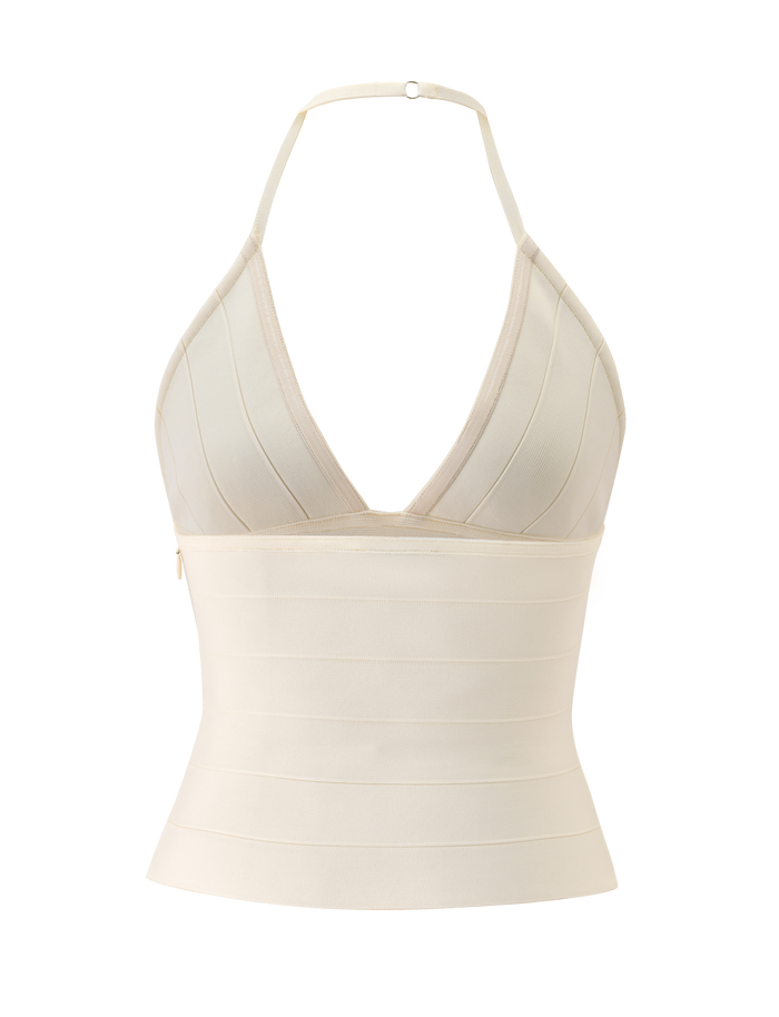 The NYX BANDAGE TOP in cream by TIGERMIST is a halter neck top with a deep V neckline, plunging triangle cups, and a sculpted fit, shown against a plain white background.